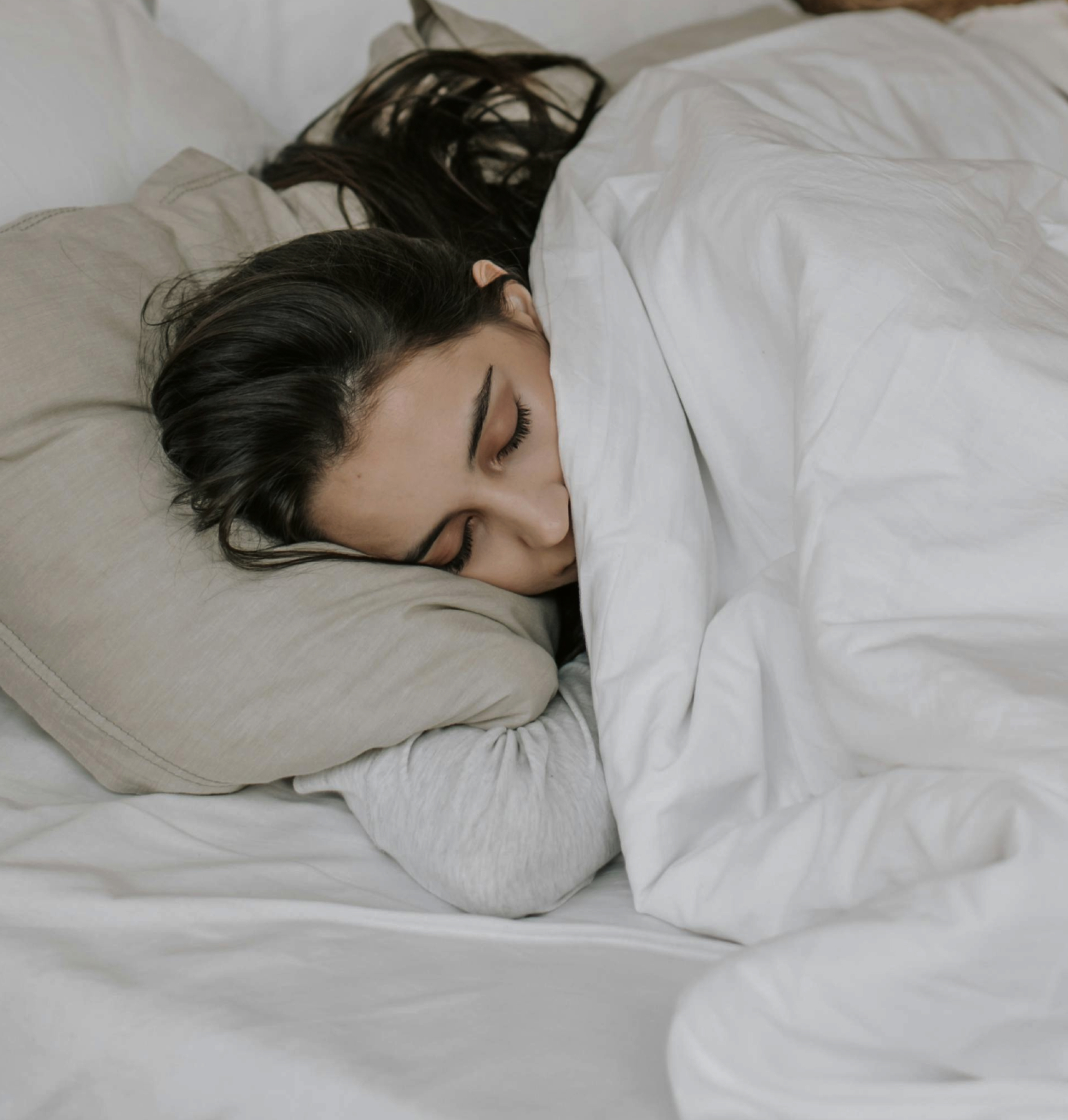 Person practicing meditation for sleep with RelaxFrens guided sleep meditation app